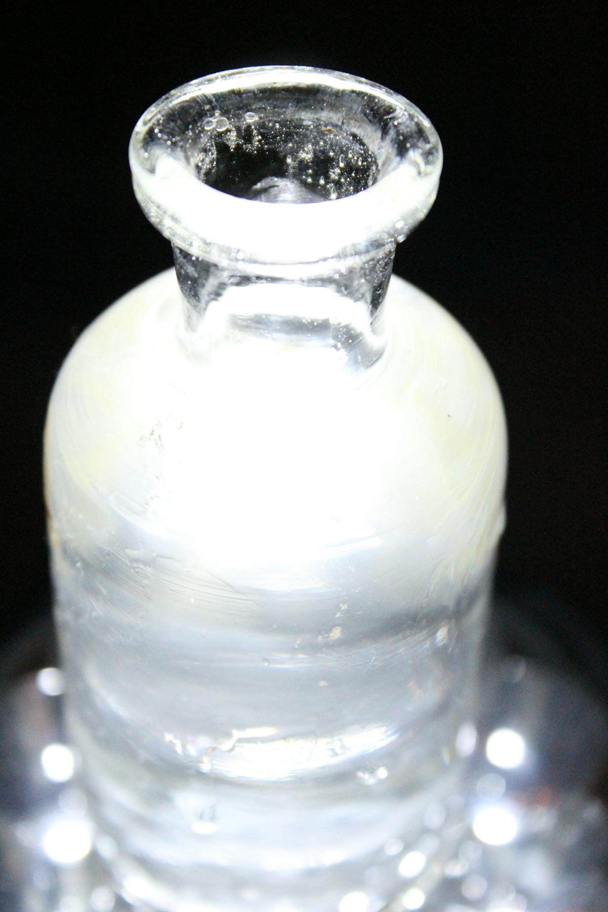 Musician leaving a dark stage with a spotlight behind them, symbolizing an artist’s exit