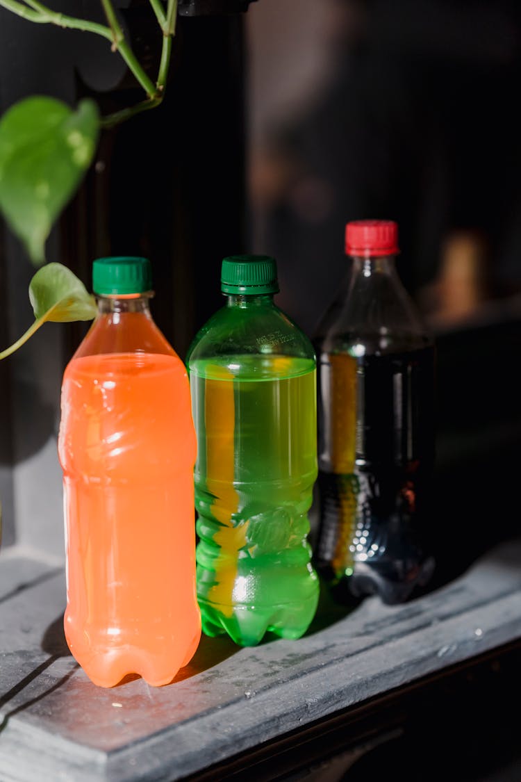 Plastic Bottles Of Different Sorts On Table