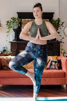 A woman doing a yoga pose at home with peaceful surroundings, embracing fitness.