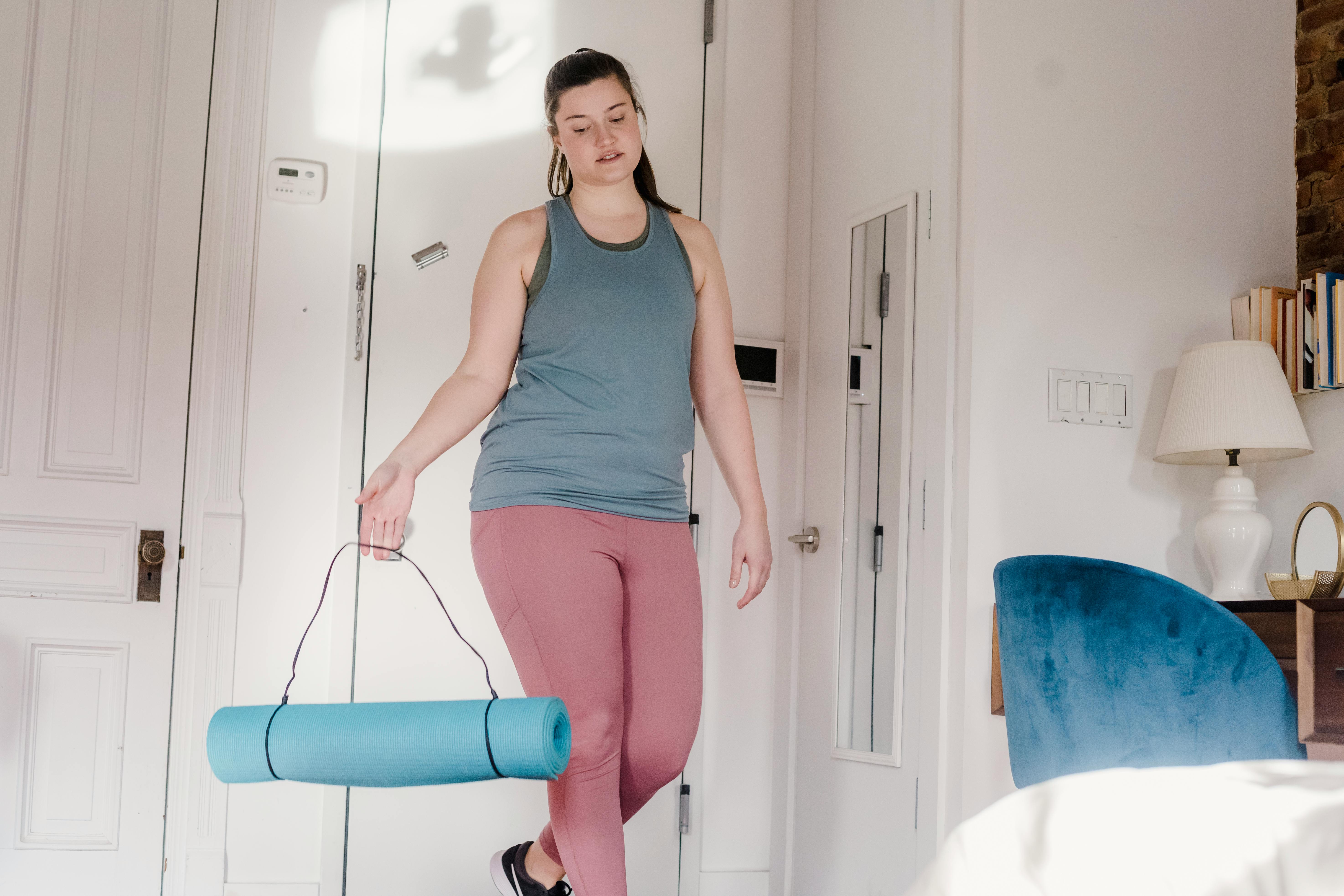 Woman Carrying Yoga Mat