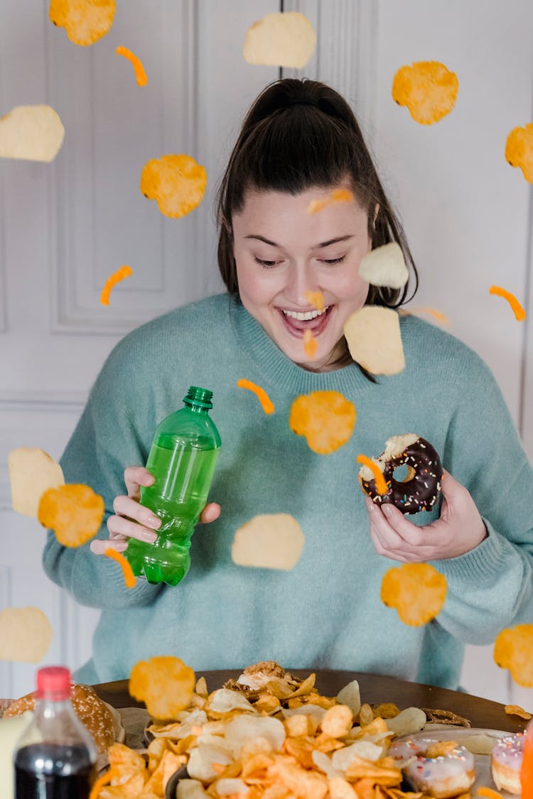 Happy Woman With Donut And Bottle With Beverage