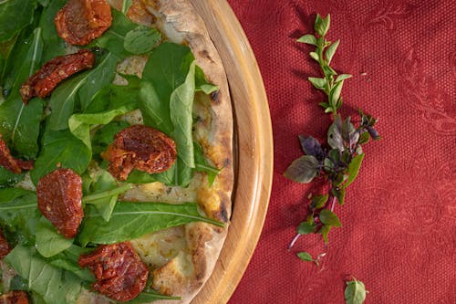 Basil Pizza in a Round Wooden Tray