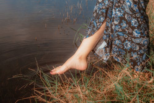 Woman Leg Stepping in Water