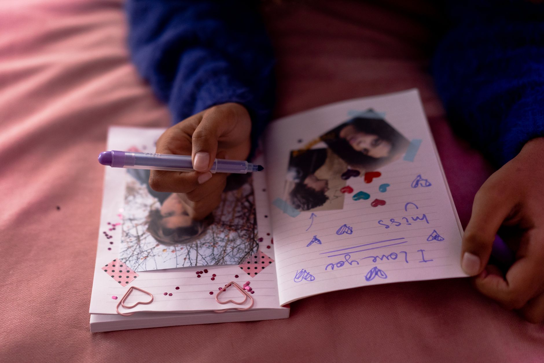 Child focusing on coloring with crayons