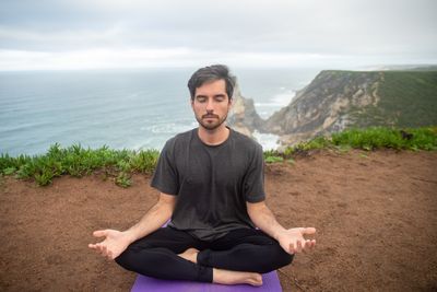 A seated figure breathing slowly — photo by Kampus Production on Pexels