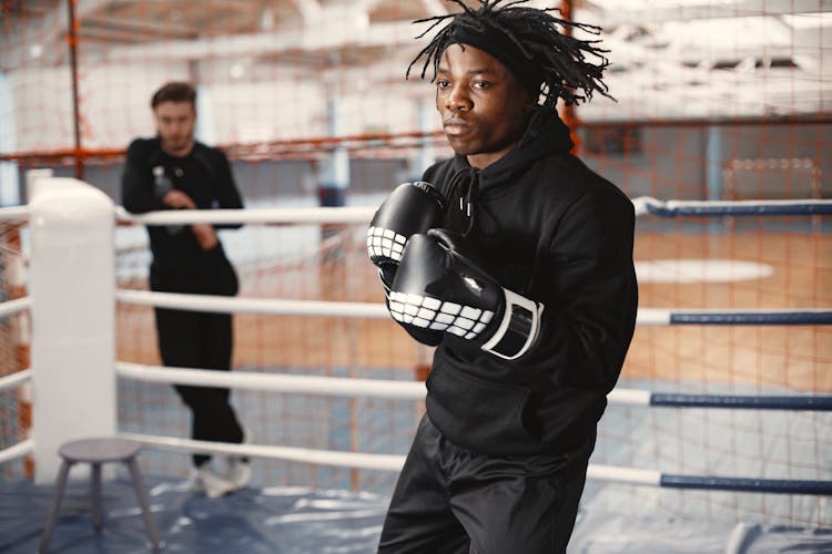 Man In Boxing Gloves Training On Ring