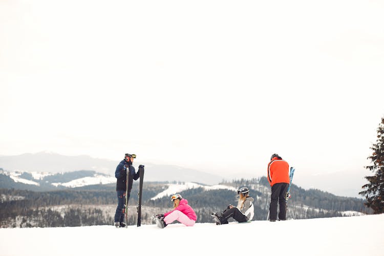 People On Skis And Snowboards