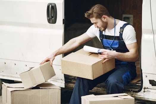 Man in uniform sorts packages by a white van, emphasizing efficient delivery service.