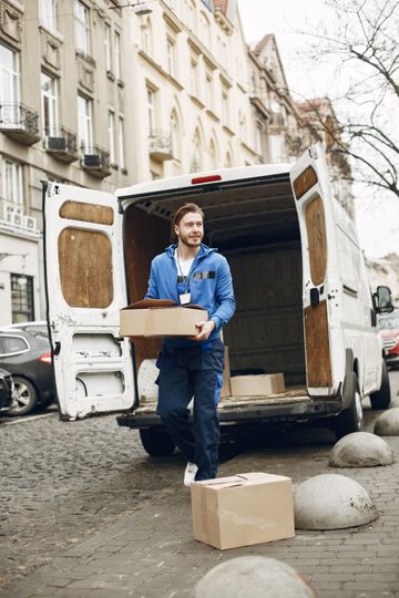 Courier unloading a delivery van