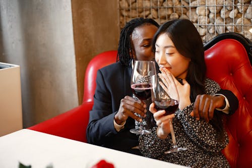 Free Affectionate Couple holding Wine Glasses Stock Photo