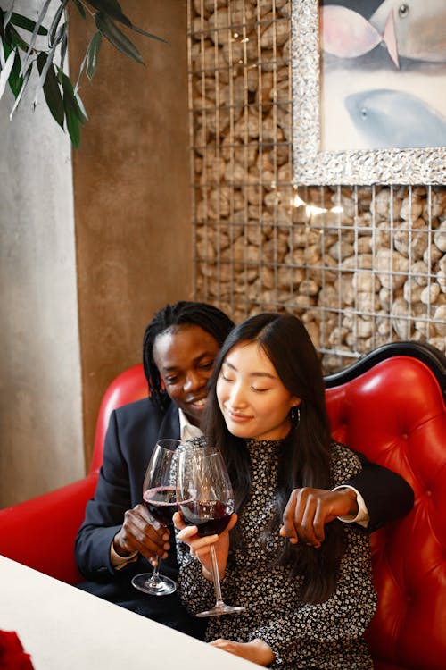 Romantic Couple holding Wine Glasses