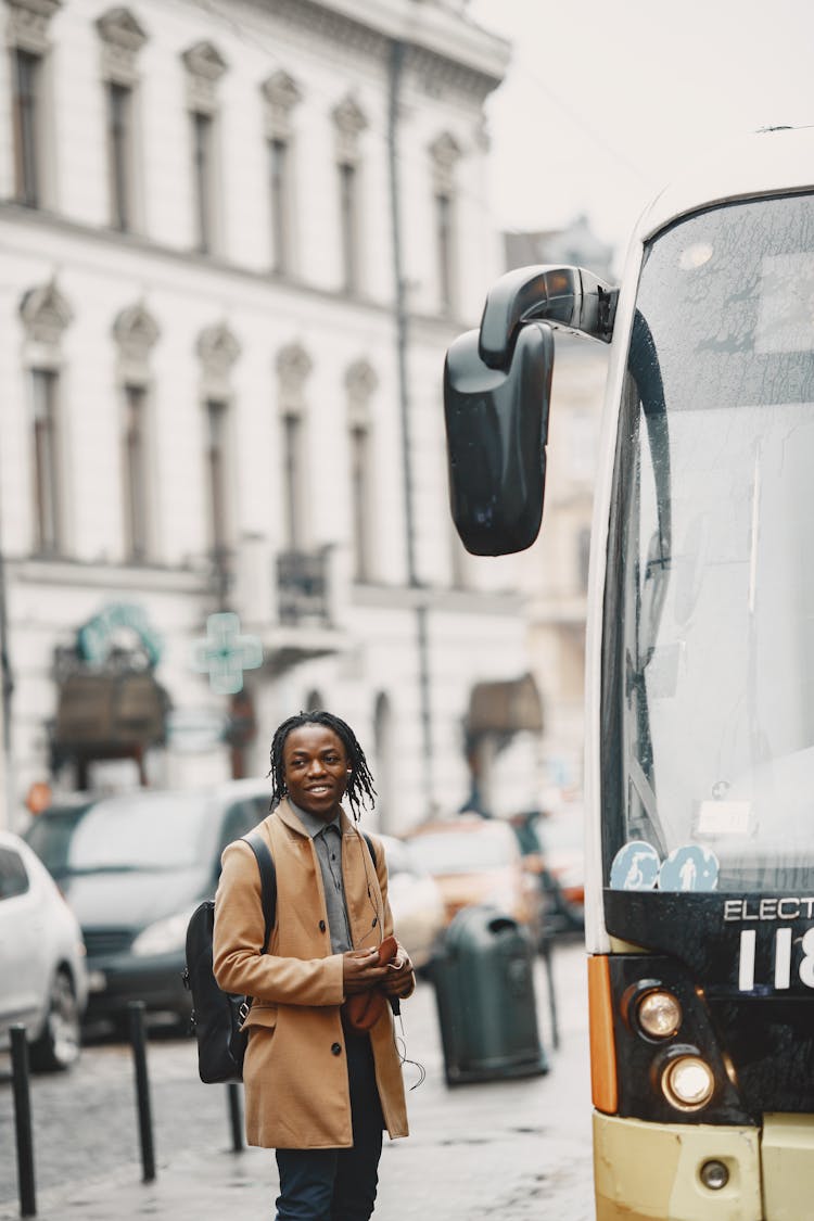 Smiling Man Near Bus On Street