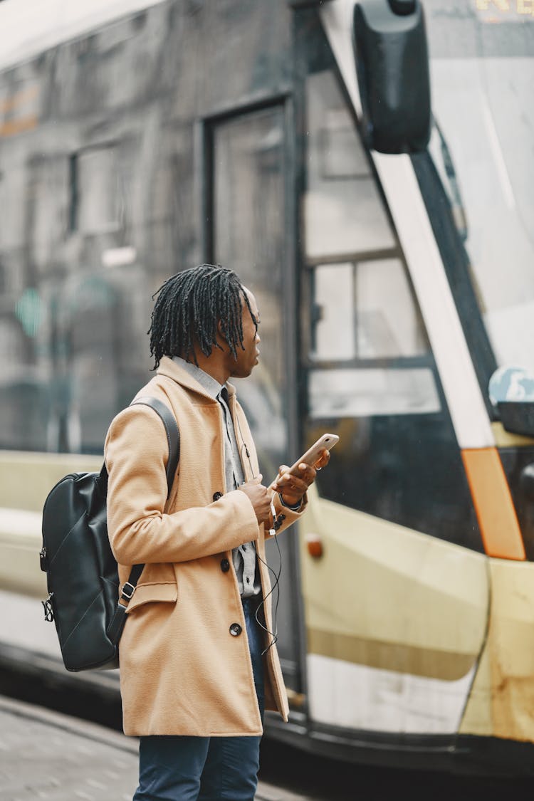 Man Waiting For Bus On Street