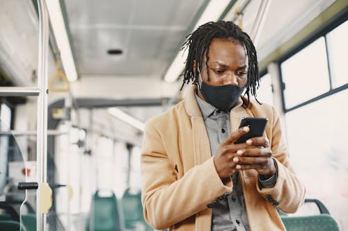 Man Using Phone Inside the Bus 