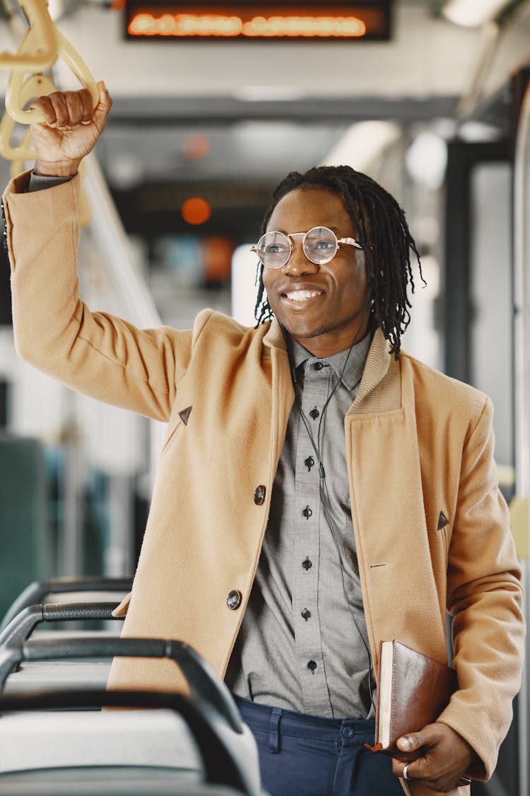 Portrait Of Man Standing In Bus Smiling