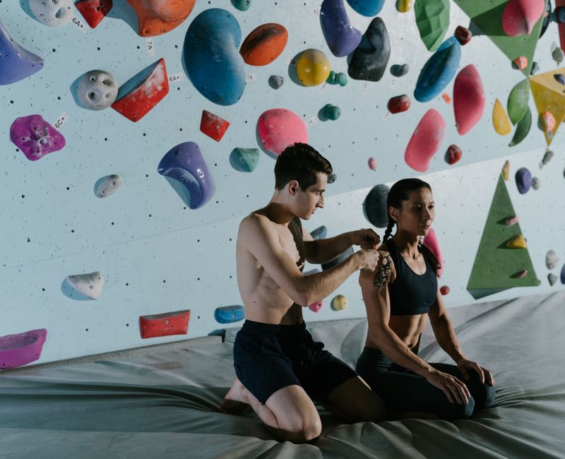 Athlete applying a natural wellness patch before training