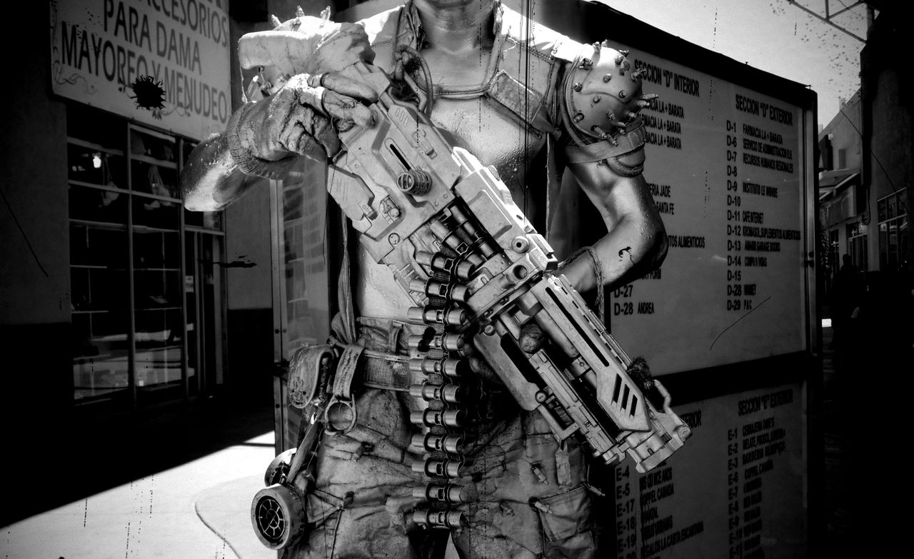 a black and white image of a cyberpunk soldier character in tijuana me