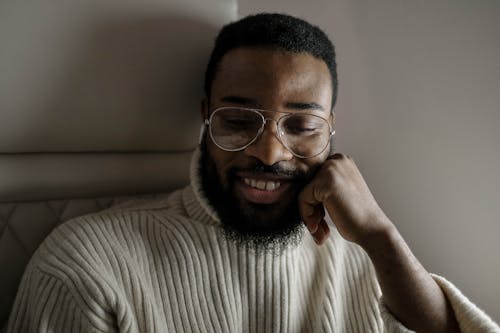 A Happy Man in Turtleneck Sweater Wearing Eyeglasses