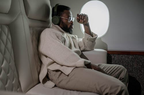 Man Sitting Near the Airplane Window