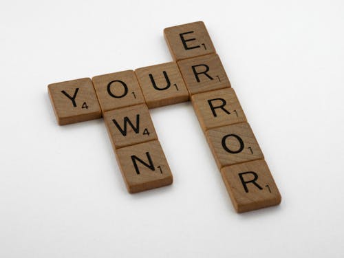 Brown Wooden Letter Blocks on the Table