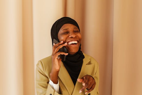 Free Woman in Brown Coat Wearing Black Hijab Stock Photo