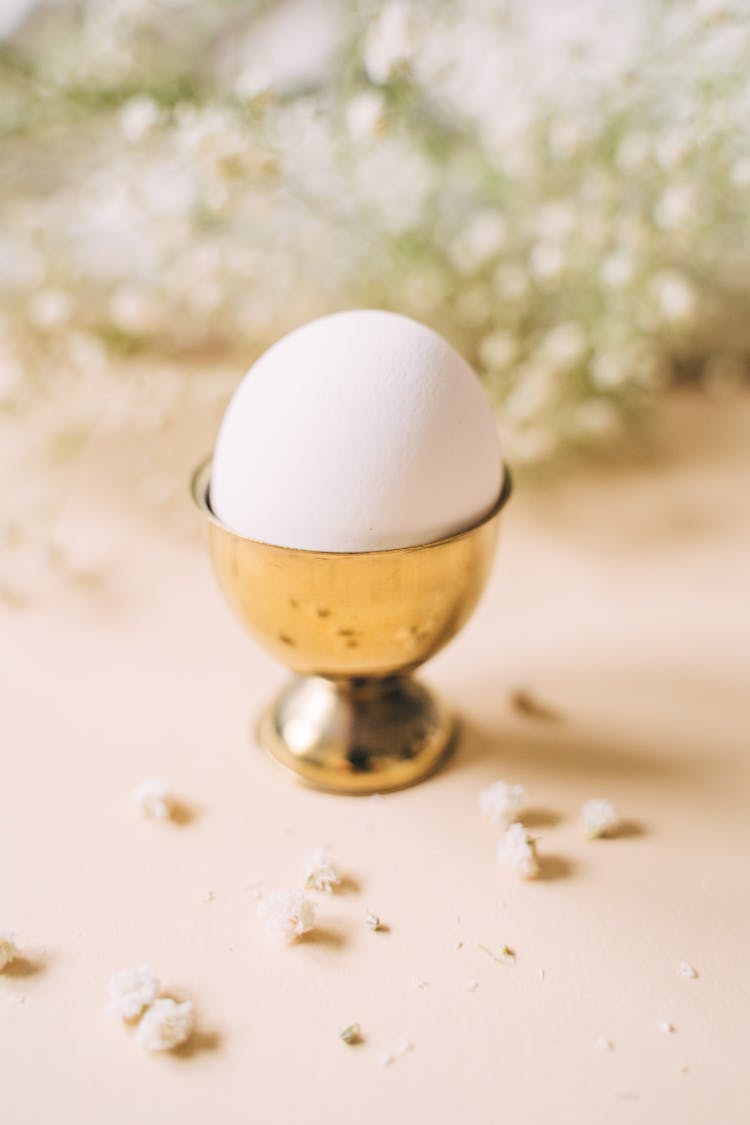 A White Egg On A Gold Stand