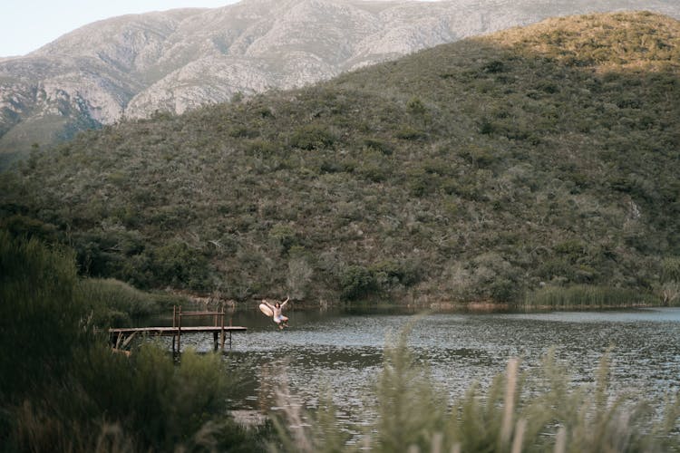 Person Jumping Into The Lake