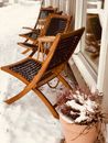 Brown Wooden Armchair on Snow Covered Ground
