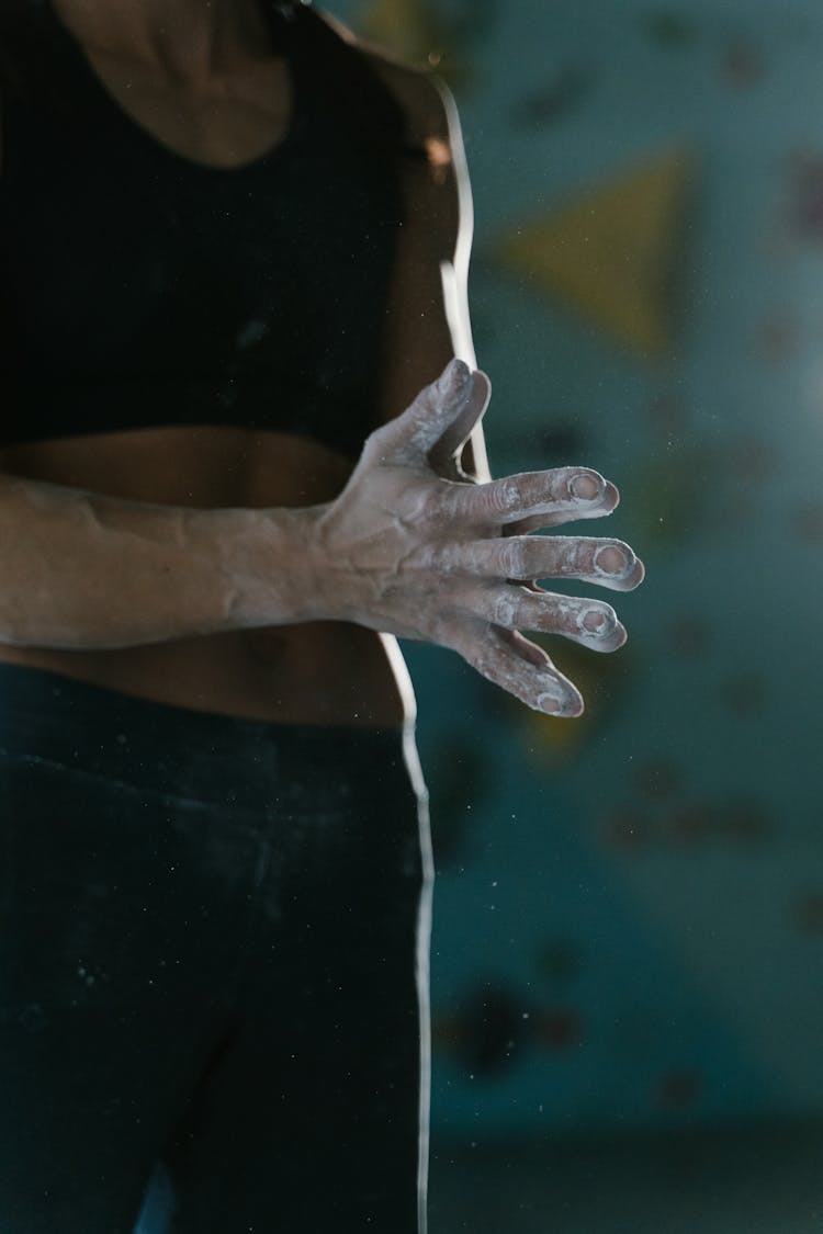 Woman In Black Activewear With Talc On Hands