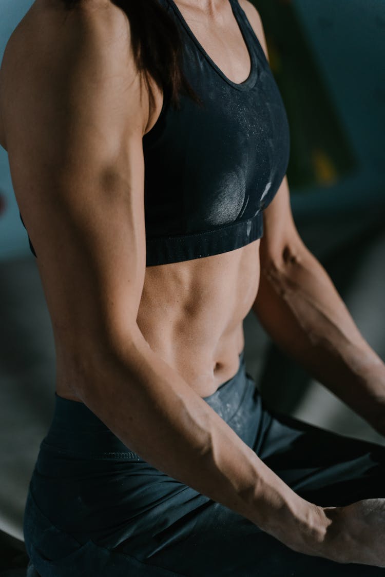 Anonymous Fit Sportswoman Relaxing After Training Training