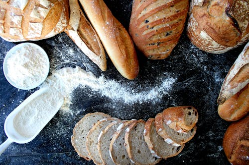 Assorted Breads on Black Table