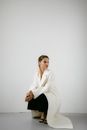 Woman in White Blazer and Black Pants