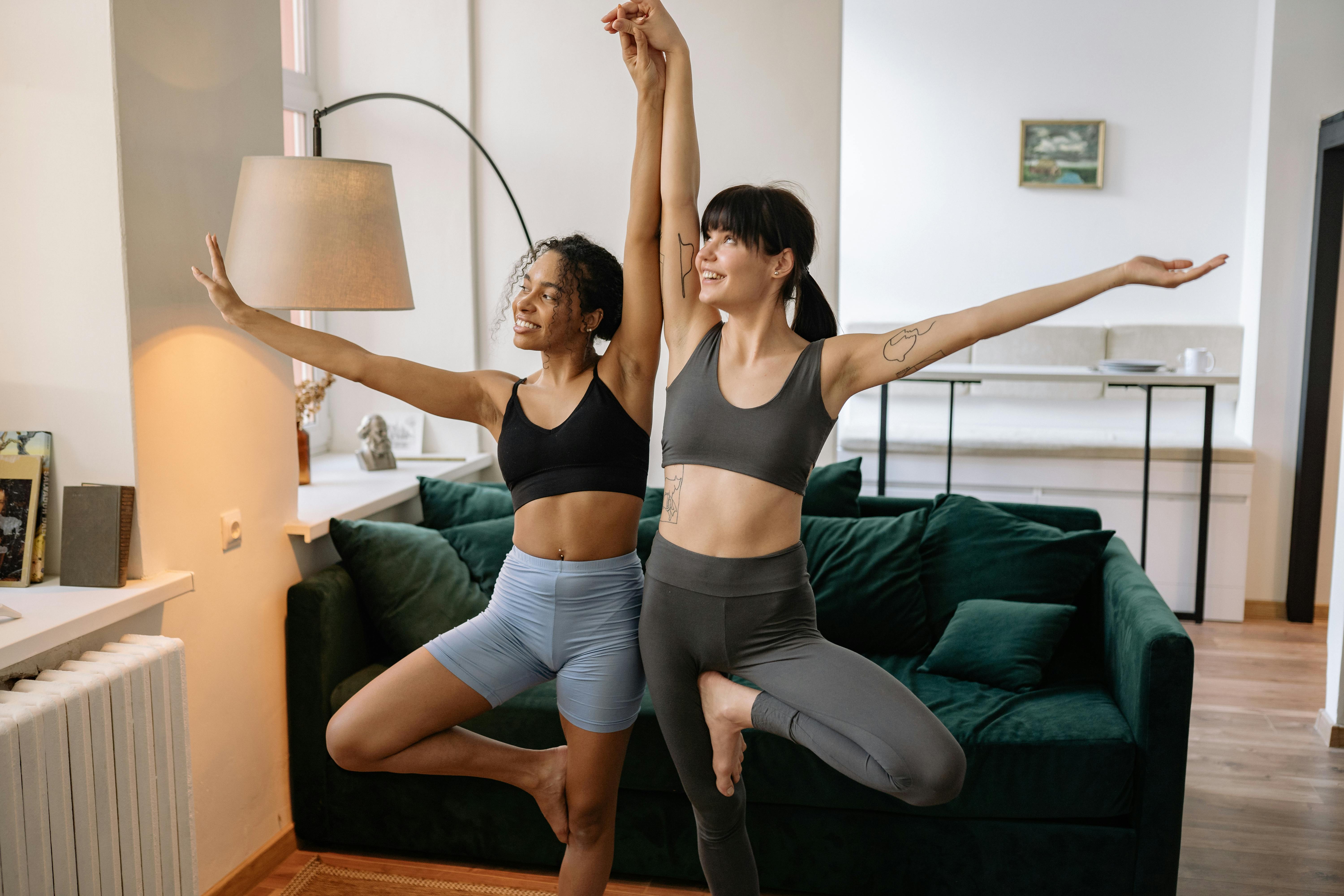 Free Two Women in Fitness Wear Doing Yoga Stock Photo