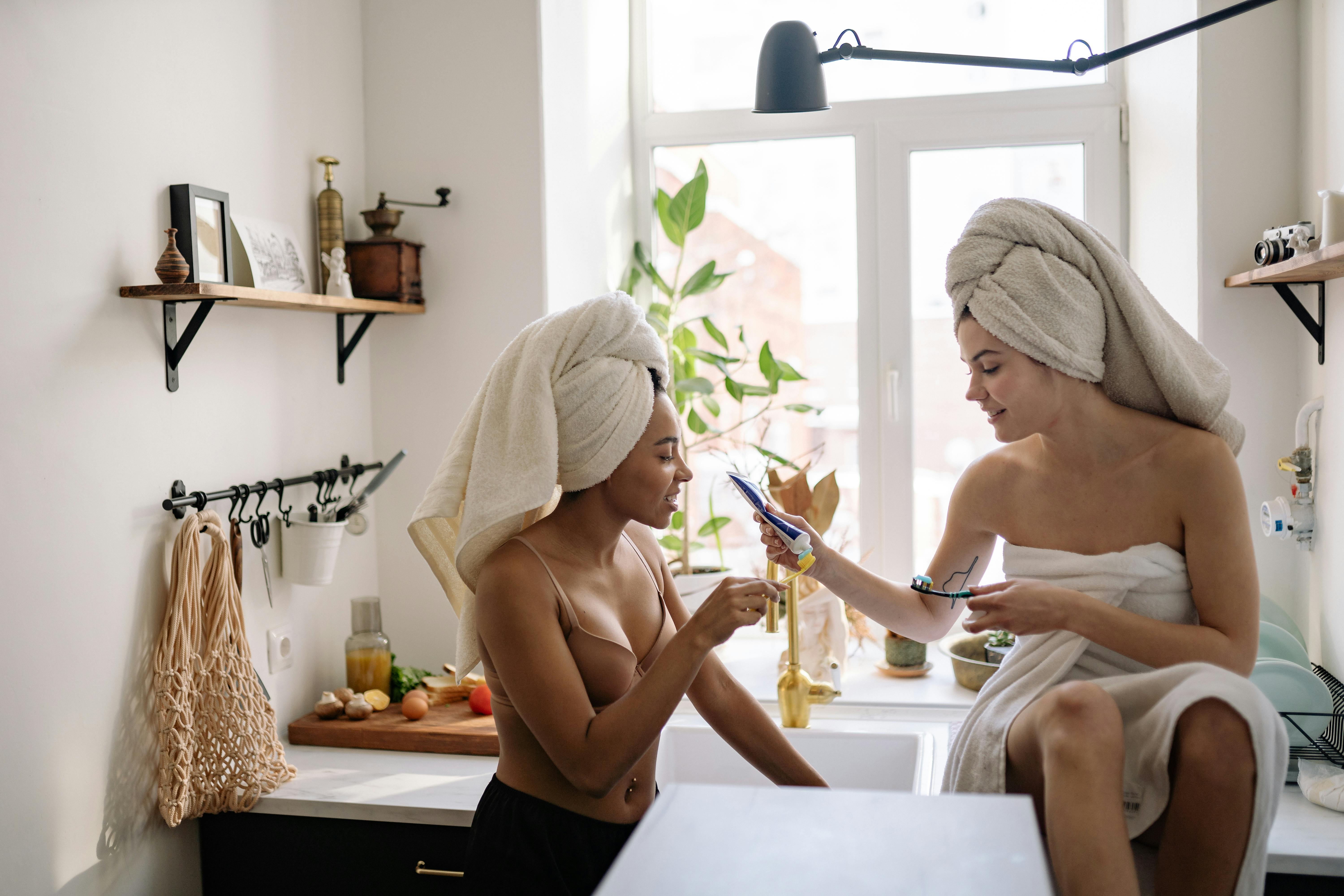 girls in the kitchen with towels on their heads