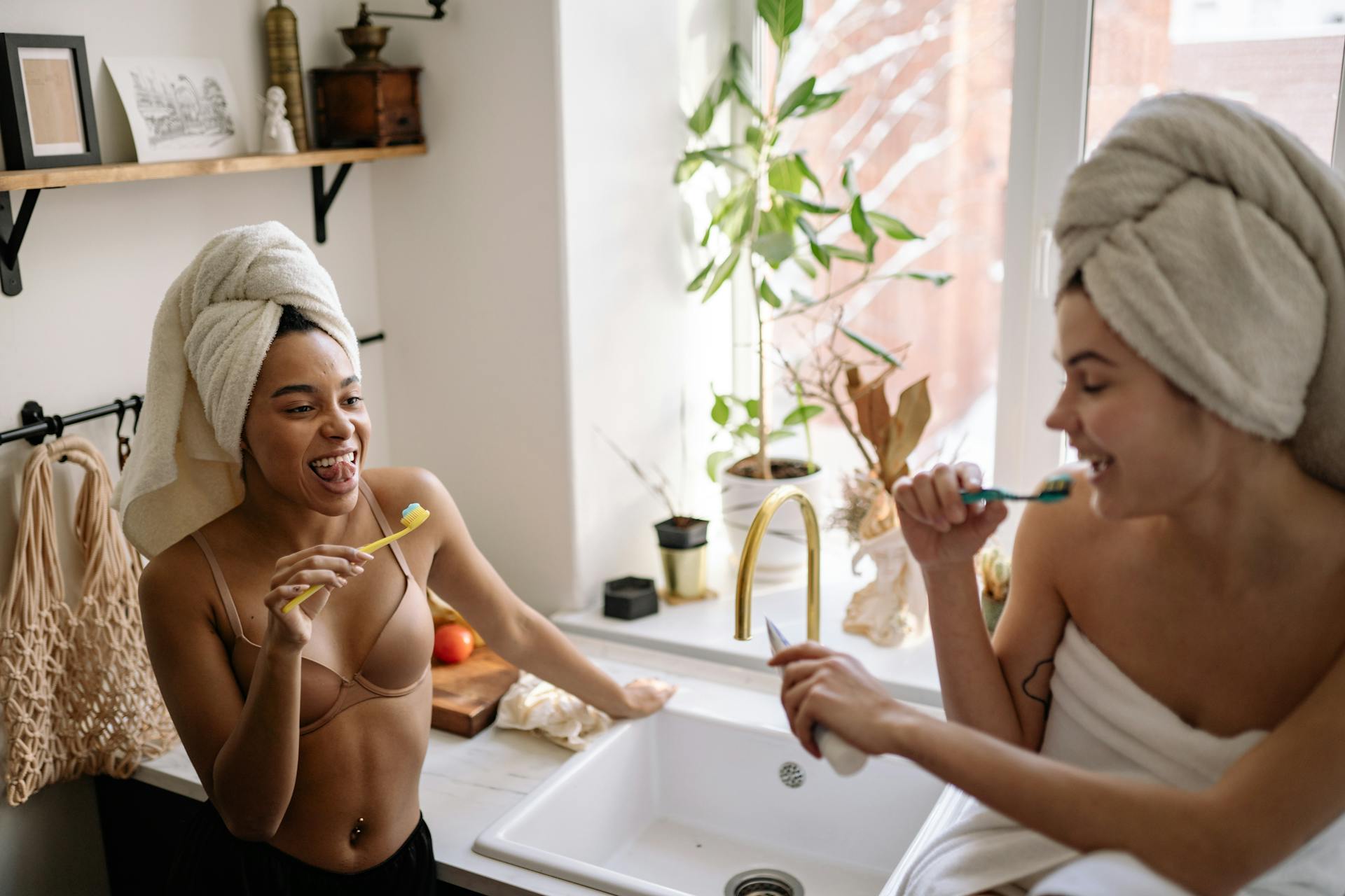 Two Women Brushing Teeth Together