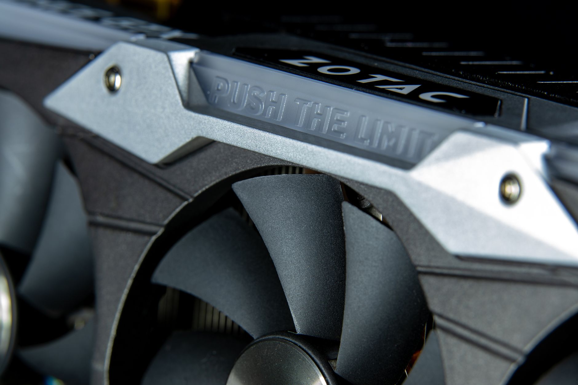 Detailed image of a graphics card with metal cooling fans and branding.