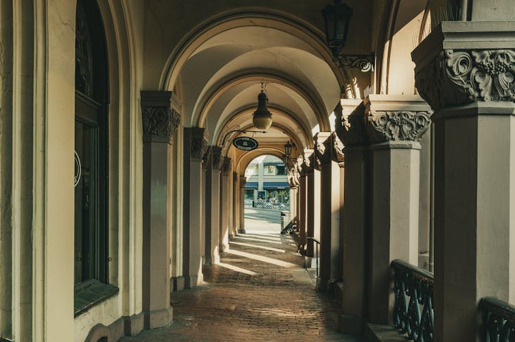 Path Leading Under Arcades Of Building