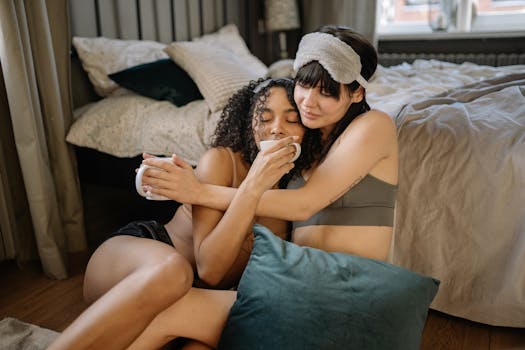 Loving LGBTQ couple enjoying a cozy morning together in their bedroom.