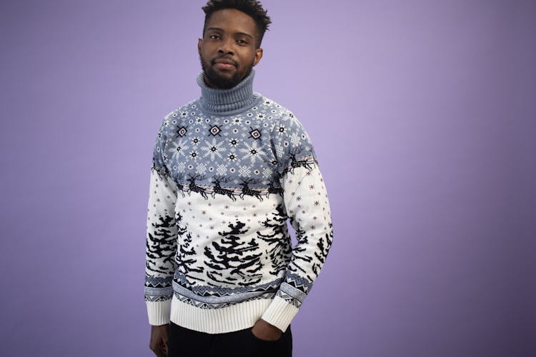 Man In Winter Sweater On Purple Back