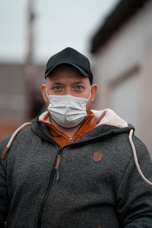 Male wearing warm wear and cap with mask for protection and prevention spread of coronavirus