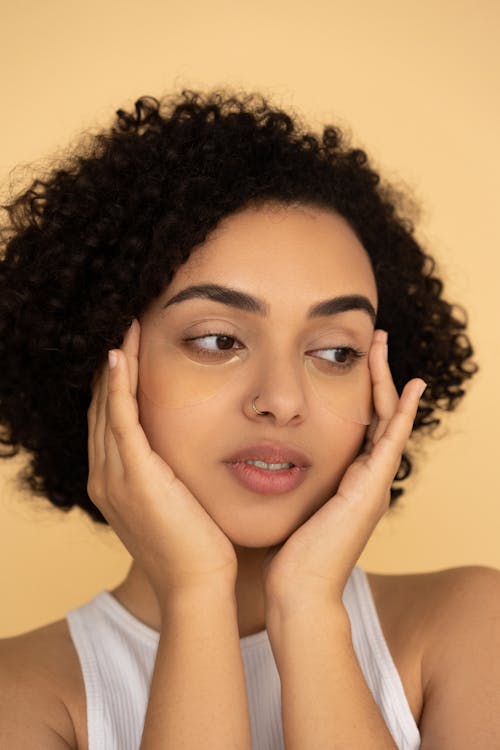 Free Woman Massaging Her Face Stock Photo