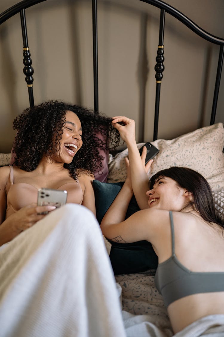 Couple Lying Down While Laughing Together