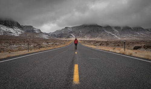 A Man Standing on the Road