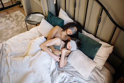 Free A Couple Sleeping Together while Wearing Sleep Mask Stock Photo