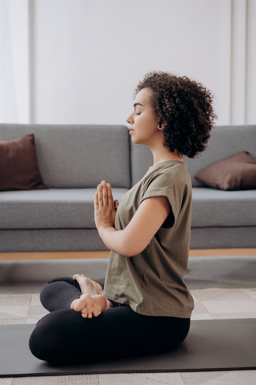 Free Side View Of A Woman Doing Yoga Stock Photo