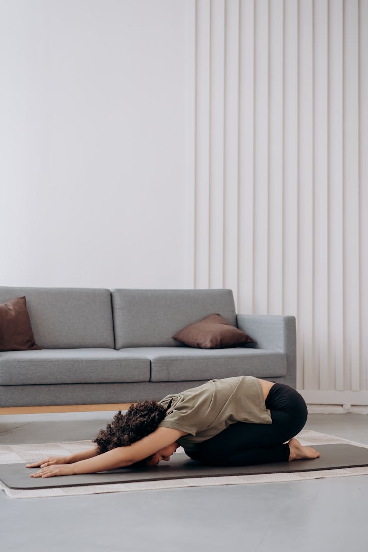 Woman In Brown Shirt In A Bending Position