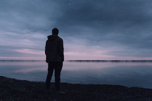 Free Person Standing Near Lake Stock Photo