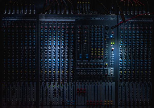 Audio engineer at a studio desk — photo by Alberto Calleja on Pexels