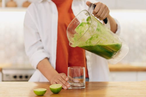 Pouring of Fruit Smoothie on Glass