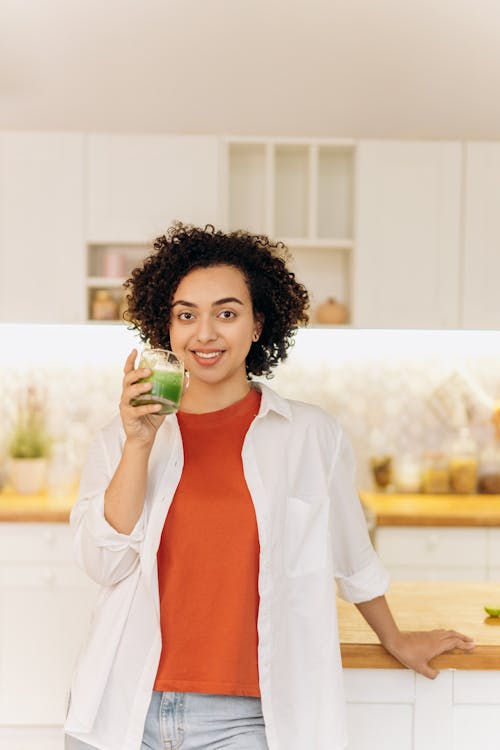 Woman in White Blazer Drinking Fresh Smoothie